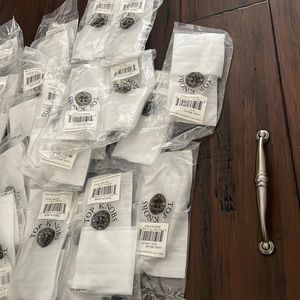 Top Knobs 29 piece 5/16 inch cc Brush Satin Nickel handles.